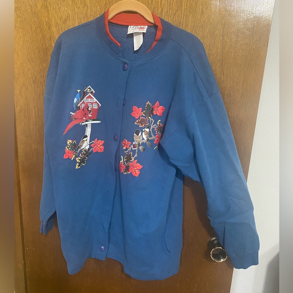 Blue long sleeve fleece jacket with printed birds.  Size large.  Morning Sun.